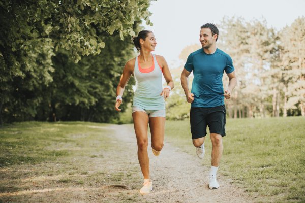 Fit couple jogging outdoors, enjoying visual freedom after implantable collamer lens surgery