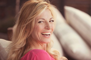 woman smiling confidently, representing relief from dry eye symptoms
